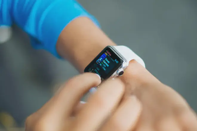 A person using an Apple Watch to update their weight with the text &ldquo;How to Change Your Weight on Apple Watch&rdquo;