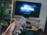 Image of a hand illustrating the process of how to restart Firestick remote