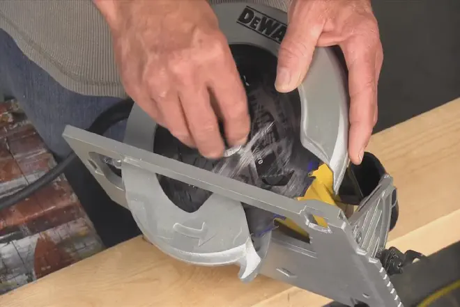Detailed guide on how to change the blade on a circular saw, showcasing tools and safety precautions.